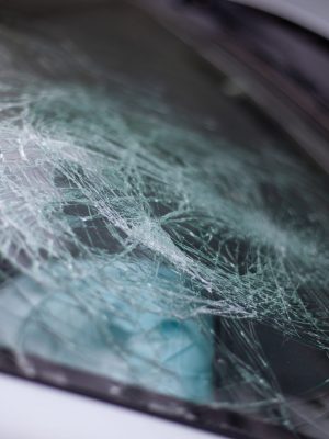 A broken car windshield after an accident